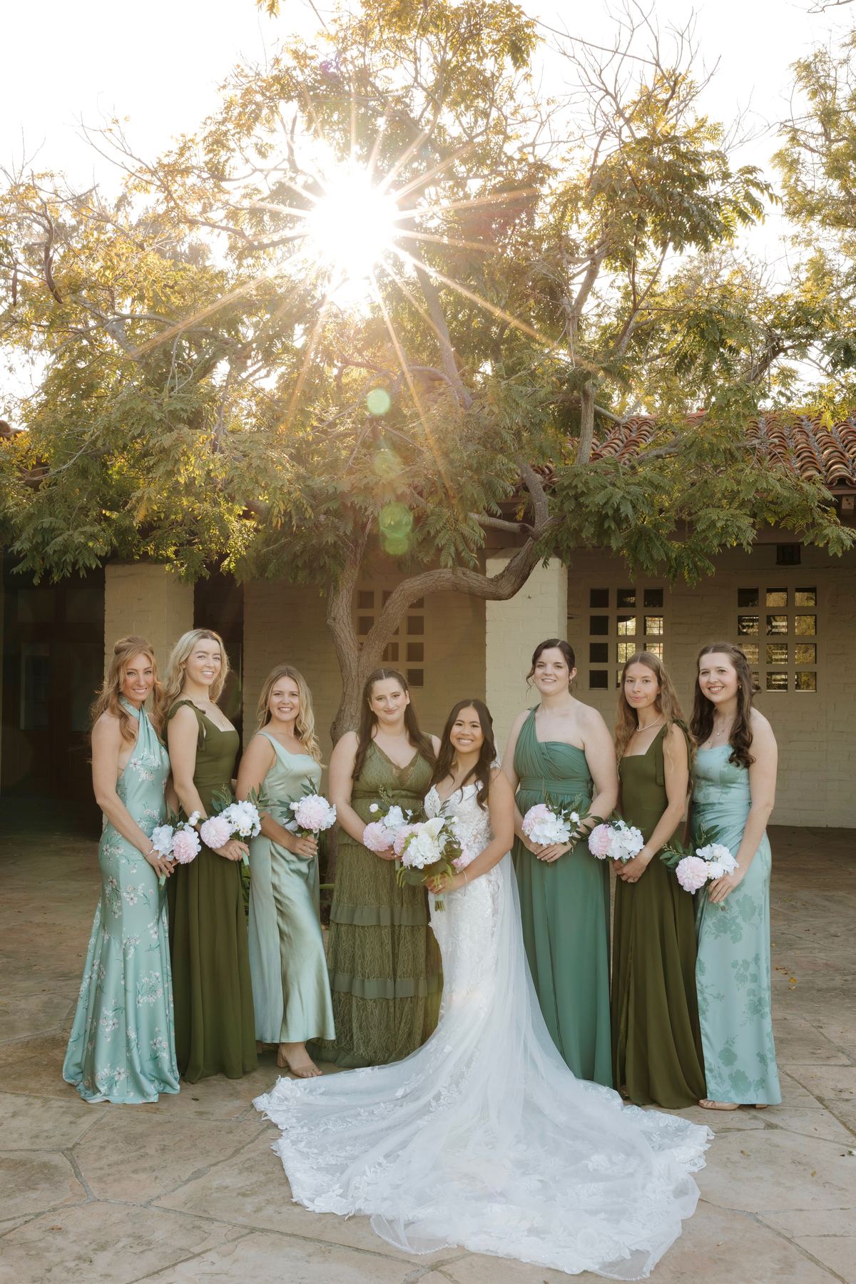Bridal party holding coordinating bouquets